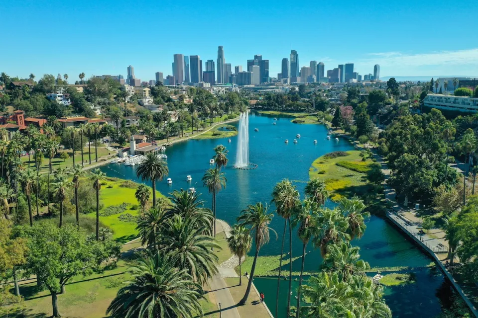 Downtown Los Angeles viewed from Echo Park with lake with artesian fountain in foreground.